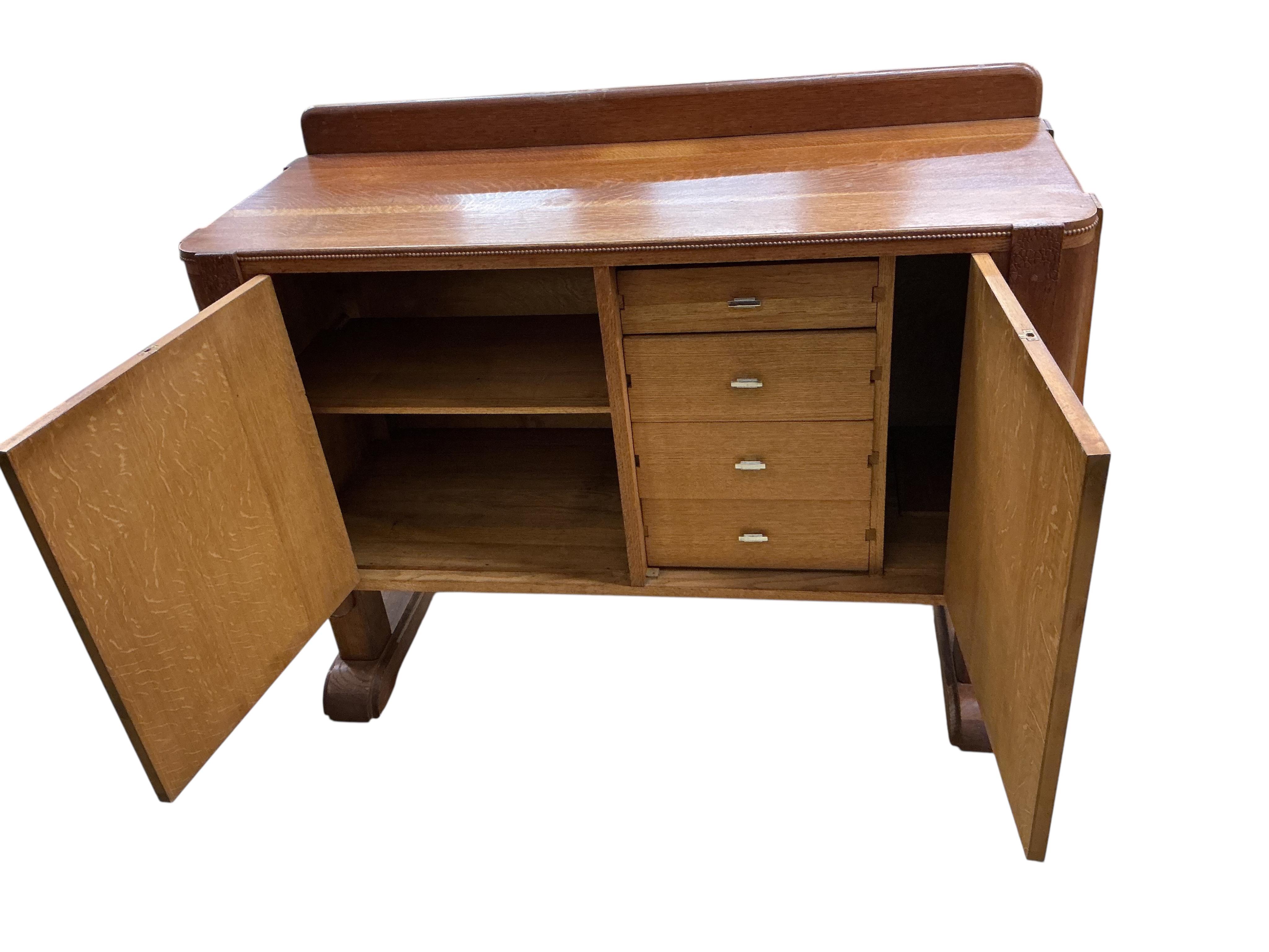 An Art Deco oak sideboard, width 134cm, depth 53cm, height 100cm